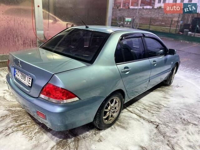 Зеленый Мицубиси Лансер, объемом двигателя 1.58 л и пробегом 352 тыс. км за 3700 $, фото 12 на Automoto.ua