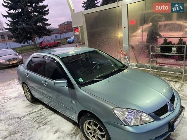 Зеленый Мицубиси Лансер, объемом двигателя 1.58 л и пробегом 352 тыс. км за 3700 $, фото 3 на Automoto.ua