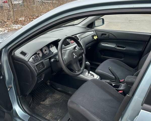 Зеленый Мицубиси Лансер, объемом двигателя 1.58 л и пробегом 207 тыс. км за 4200 $, фото 2 на Automoto.ua