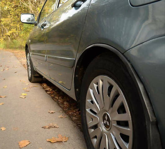 Зеленый Мицубиси Лансер, объемом двигателя 1.58 л и пробегом 259 тыс. км за 4300 $, фото 3 на Automoto.ua