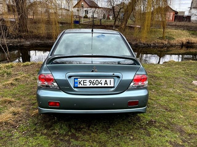 Зелений Міцубісі Lancer, об'ємом двигуна 2 л та пробігом 225 тис. км за 5600 $, фото 5 на Automoto.ua