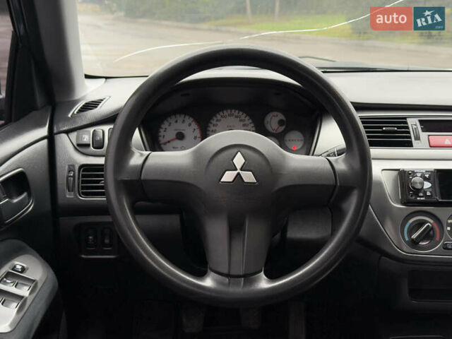 Зеленый Мицубиси Лансер, объемом двигателя 1.6 л и пробегом 214 тыс. км за 4150 $, фото 14 на Automoto.ua