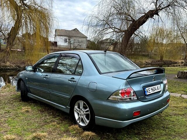 Зелений Міцубісі Lancer, об'ємом двигуна 2 л та пробігом 225 тис. км за 5600 $, фото 4 на Automoto.ua