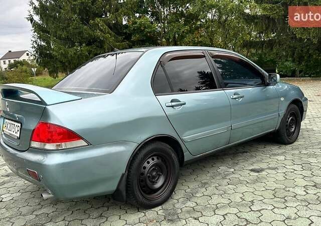 Зелений Міцубісі Lancer, об'ємом двигуна 1.58 л та пробігом 207 тис. км за 3400 $, фото 4 на Automoto.ua