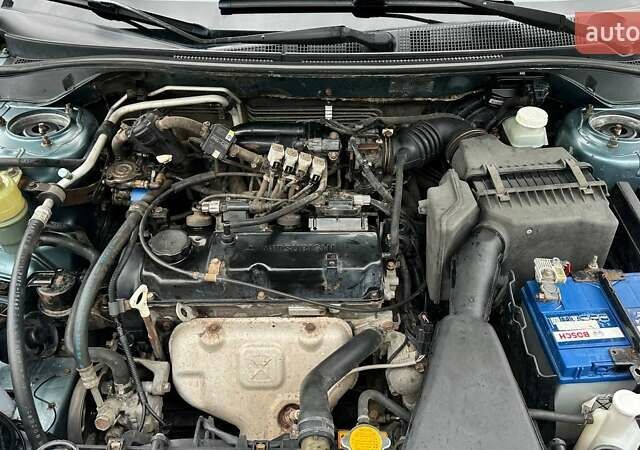 Зелений Міцубісі Lancer, об'ємом двигуна 1.58 л та пробігом 207 тис. км за 3400 $, фото 21 на Automoto.ua