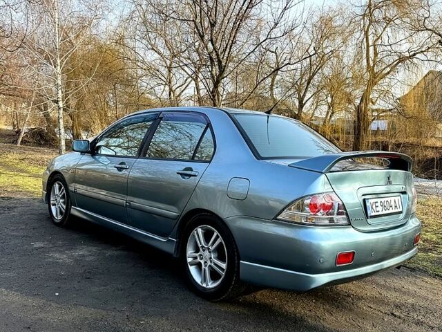 Зелений Міцубісі Lancer, об'ємом двигуна 2 л та пробігом 225 тис. км за 5600 $, фото 6 на Automoto.ua