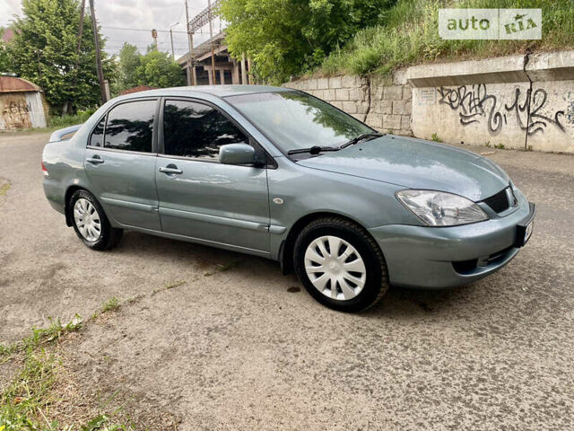 Зелений Міцубісі Lancer, об'ємом двигуна 1.6 л та пробігом 220 тис. км за 4750 $, фото 9 на Automoto.ua