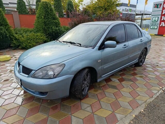 Зелений Міцубісі Lancer, об'ємом двигуна 2 л та пробігом 238 тис. км за 3400 $, фото 6 на Automoto.ua