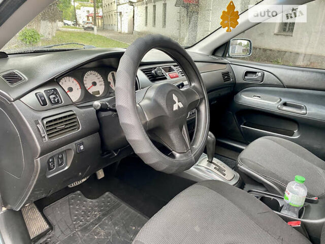 Зелений Міцубісі Lancer, об'ємом двигуна 1.6 л та пробігом 220 тис. км за 4750 $, фото 31 на Automoto.ua