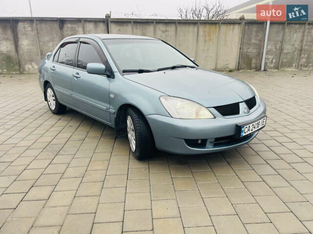 Зеленый Мицубиси Лансер, объемом двигателя 1.6 л и пробегом 164 тыс. км за 5000 $, фото 4 на Automoto.ua