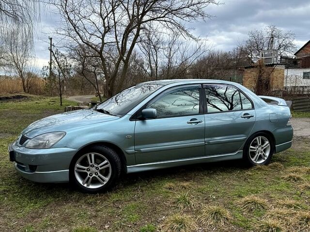 Зелений Міцубісі Lancer, об'ємом двигуна 2 л та пробігом 225 тис. км за 5600 $, фото 2 на Automoto.ua