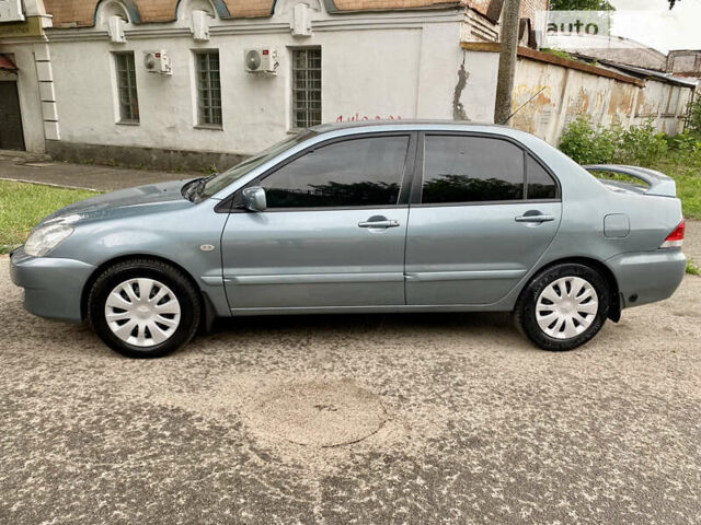 Зелений Міцубісі Lancer, об'ємом двигуна 1.6 л та пробігом 220 тис. км за 4750 $, фото 3 на Automoto.ua