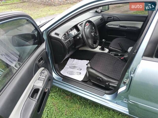 Зеленый Мицубиси Лансер, объемом двигателя 1.58 л и пробегом 300 тыс. км за 3999 $, фото 5 на Automoto.ua