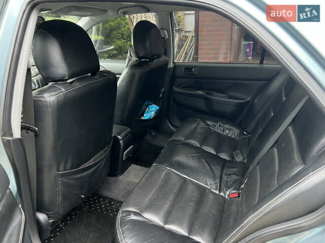 Зелений Міцубісі Lancer, об'ємом двигуна 1.6 л та пробігом 217 тис. км за 5400 $, фото 7 на Automoto.ua