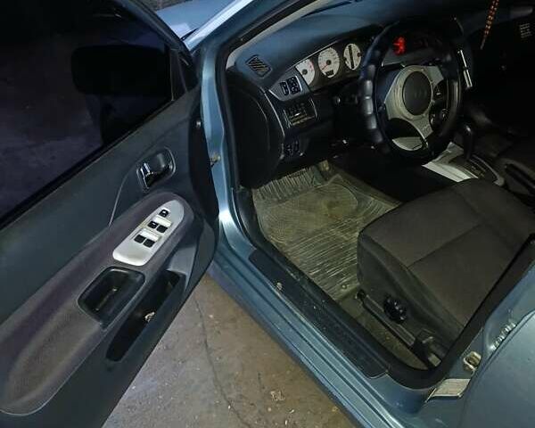 Зелений Міцубісі Lancer, об'ємом двигуна 2 л та пробігом 238 тис. км за 2999 $, фото 9 на Automoto.ua