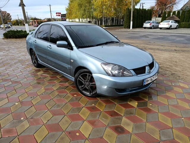 Зелений Міцубісі Lancer, об'ємом двигуна 2 л та пробігом 238 тис. км за 3400 $, фото 5 на Automoto.ua