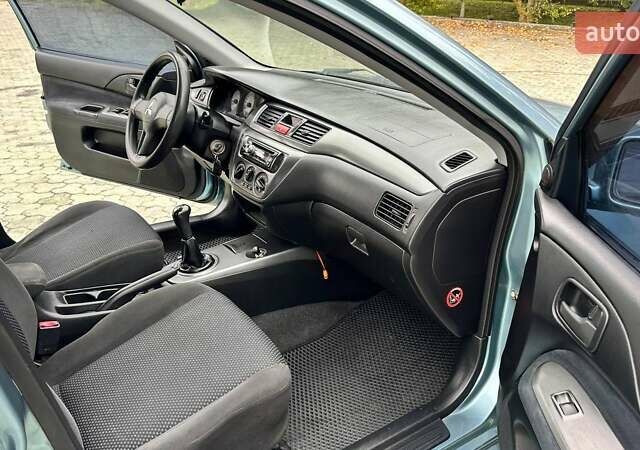 Зелений Міцубісі Lancer, об'ємом двигуна 1.58 л та пробігом 207 тис. км за 3400 $, фото 15 на Automoto.ua