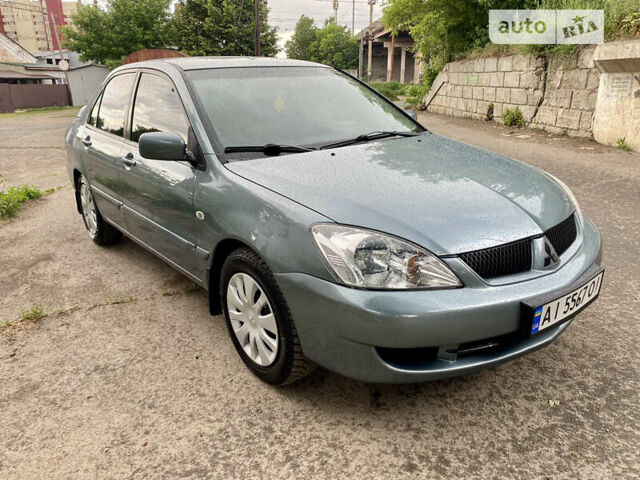 Зелений Міцубісі Lancer, об'ємом двигуна 1.6 л та пробігом 220 тис. км за 4750 $, фото 10 на Automoto.ua