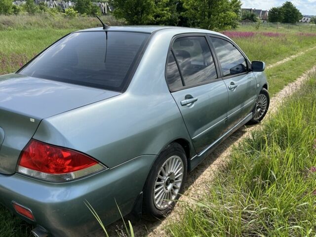 Зеленый Мицубиси Лансер, объемом двигателя 1.6 л и пробегом 309 тыс. км за 3800 $, фото 8 на Automoto.ua