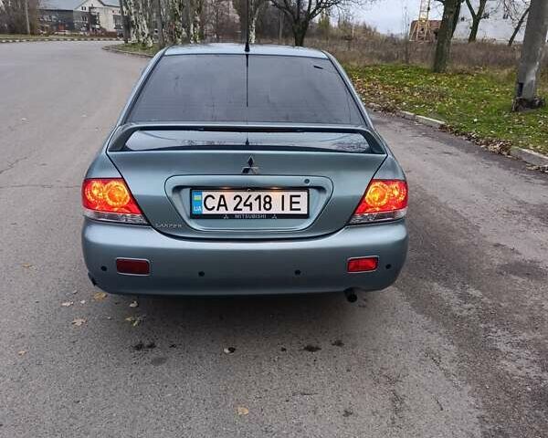 Зелений Міцубісі Lancer, об'ємом двигуна 1.6 л та пробігом 162 тис. км за 4700 $, фото 5 на Automoto.ua