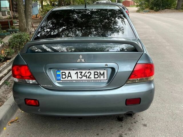 Зеленый Мицубиси Лансер, объемом двигателя 1.6 л и пробегом 255 тыс. км за 4000 $, фото 1 на Automoto.ua