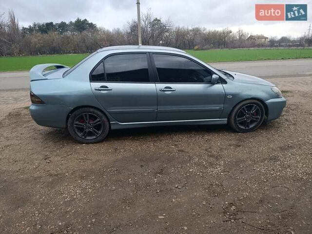 Зелений Міцубісі Lancer, об'ємом двигуна 2 л та пробігом 238 тис. км за 2999 $, фото 4 на Automoto.ua