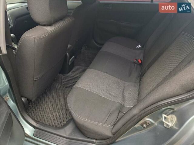 Зеленый Мицубиси Лансер, объемом двигателя 1.6 л и пробегом 219 тыс. км за 5300 $, фото 19 на Automoto.ua