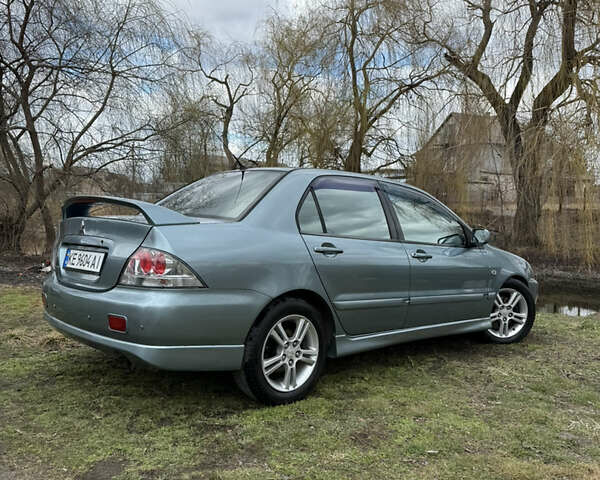 Зелений Міцубісі Lancer, об'ємом двигуна 2 л та пробігом 225 тис. км за 5599 $, фото 2 на Automoto.ua