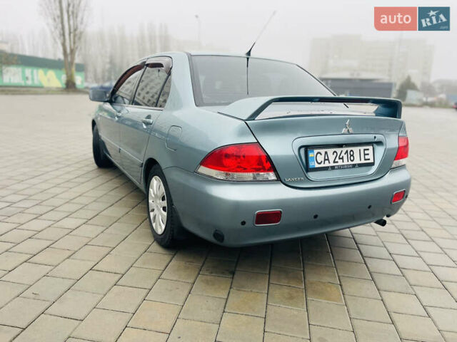 Зеленый Мицубиси Лансер, объемом двигателя 1.6 л и пробегом 164 тыс. км за 5000 $, фото 1 на Automoto.ua