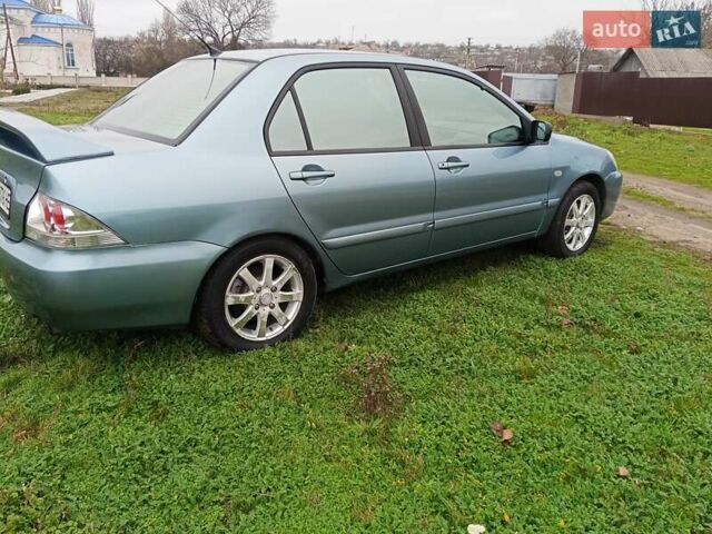 Зеленый Мицубиси Лансер, объемом двигателя 1.58 л и пробегом 300 тыс. км за 3999 $, фото 2 на Automoto.ua