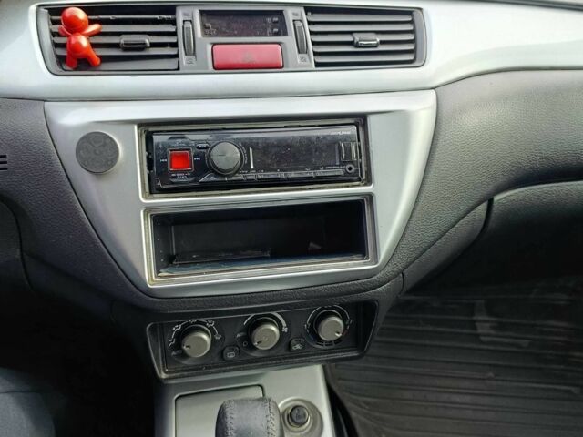 Зелений Міцубісі Lancer, об'ємом двигуна 2 л та пробігом 238 тис. км за 3400 $, фото 7 на Automoto.ua