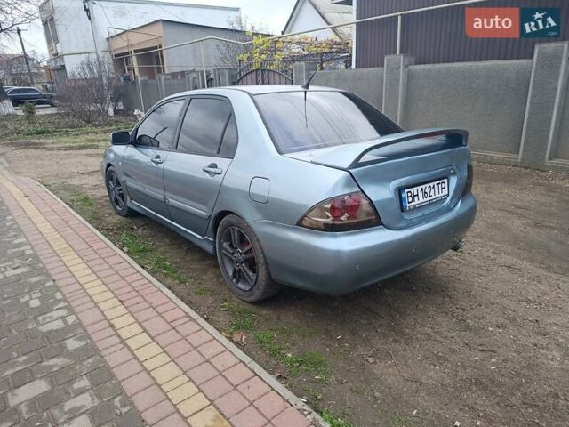 Зелений Міцубісі Lancer, об'ємом двигуна 2 л та пробігом 238 тис. км за 2999 $, фото 2 на Automoto.ua