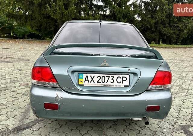 Зелений Міцубісі Lancer, об'ємом двигуна 1.58 л та пробігом 207 тис. км за 3400 $, фото 6 на Automoto.ua