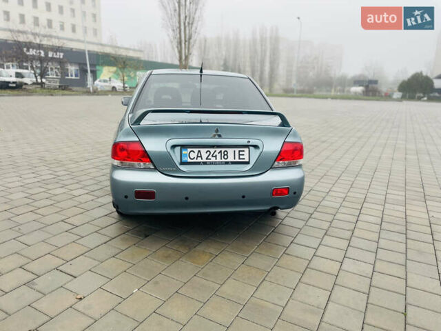 Зеленый Мицубиси Лансер, объемом двигателя 1.6 л и пробегом 164 тыс. км за 5000 $, фото 2 на Automoto.ua