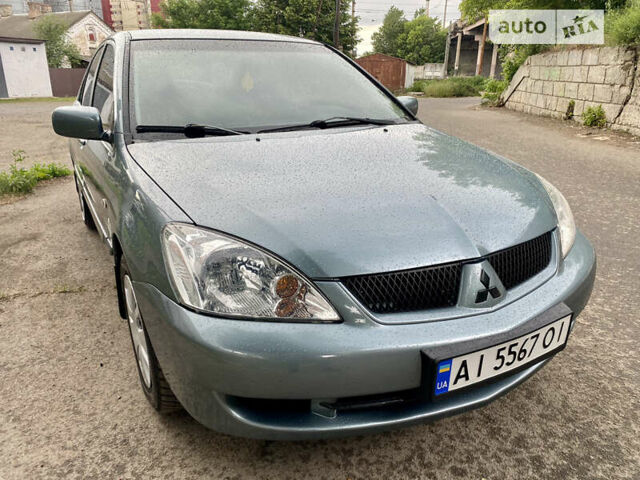 Зелений Міцубісі Lancer, об'ємом двигуна 1.6 л та пробігом 220 тис. км за 4750 $, фото 11 на Automoto.ua