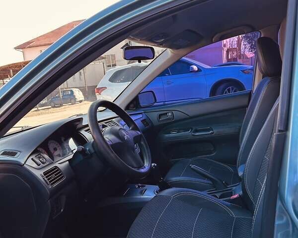 Зелений Міцубісі Lancer, об'ємом двигуна 1.6 л та пробігом 214 тис. км за 3800 $, фото 4 на Automoto.ua
