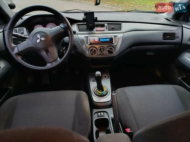 Зелений Міцубісі Lancer, об'ємом двигуна 1.6 л та пробігом 162 тис. км за 4700 $, фото 10 на Automoto.ua