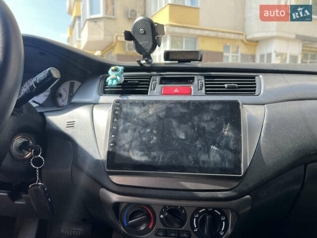 Зелений Міцубісі Lancer, об'ємом двигуна 1.6 л та пробігом 217 тис. км за 5400 $, фото 3 на Automoto.ua