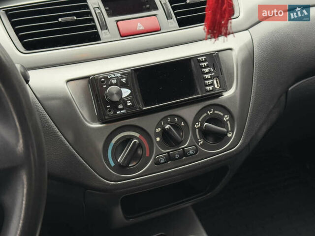 Зеленый Мицубиси Лансер, объемом двигателя 1.6 л и пробегом 214 тыс. км за 4150 $, фото 21 на Automoto.ua