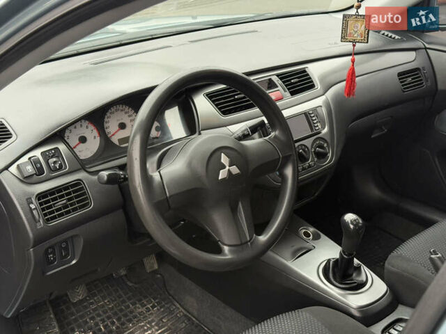 Зеленый Мицубиси Лансер, объемом двигателя 1.6 л и пробегом 214 тыс. км за 4150 $, фото 13 на Automoto.ua