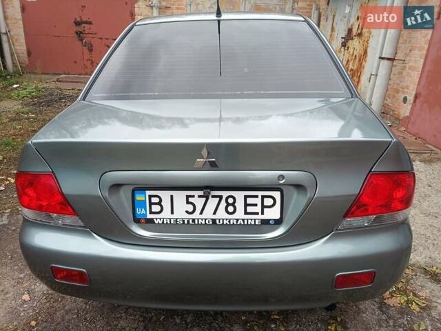 Зелений Міцубісі Lancer, об'ємом двигуна 1.6 л та пробігом 219 тис. км за 4700 $, фото 21 на Automoto.ua