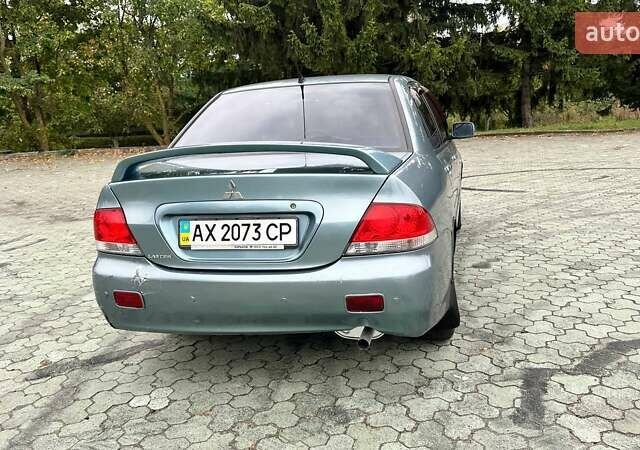 Зелений Міцубісі Lancer, об'ємом двигуна 1.58 л та пробігом 207 тис. км за 3400 $, фото 5 на Automoto.ua