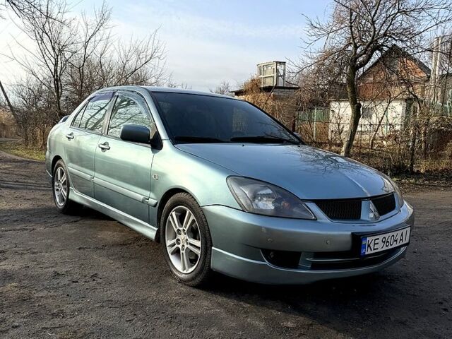 Зелений Міцубісі Lancer, об'ємом двигуна 2 л та пробігом 225 тис. км за 5600 $, фото 7 на Automoto.ua