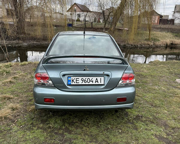 Зелений Міцубісі Lancer, об'ємом двигуна 2 л та пробігом 225 тис. км за 5599 $, фото 3 на Automoto.ua