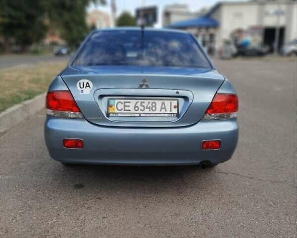 Зеленый Мицубиси Лансер, объемом двигателя 1.59 л и пробегом 128 тыс. км за 5200 $, фото 3 на Automoto.ua