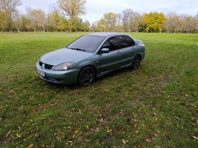Зелений Міцубісі Lancer, об'ємом двигуна 2 л та пробігом 238 тис. км за 3400 $, фото 4 на Automoto.ua
