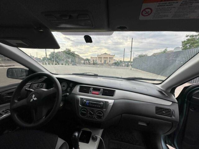 Зеленый Мицубиси Лансер, объемом двигателя 1.6 л и пробегом 300 тыс. км за 3800 $, фото 1 на Automoto.ua