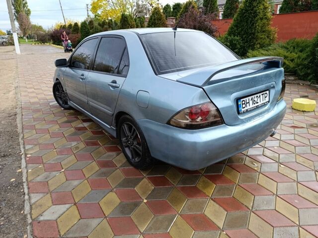 Зелений Міцубісі Lancer, об'ємом двигуна 2 л та пробігом 238 тис. км за 3400 $, фото 3 на Automoto.ua