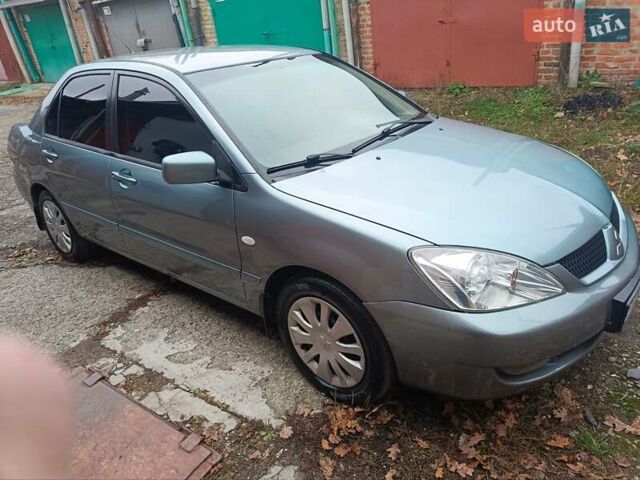 Зелений Міцубісі Lancer, об'ємом двигуна 1.6 л та пробігом 219 тис. км за 4700 $, фото 19 на Automoto.ua