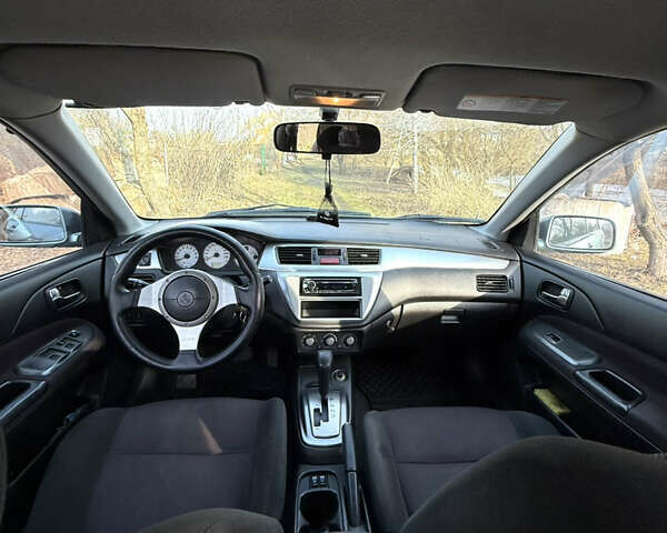 Зелений Міцубісі Lancer, об'ємом двигуна 2 л та пробігом 225 тис. км за 5599 $, фото 6 на Automoto.ua